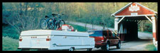 Photo of SUV towing a pop-up camper and bicycles
